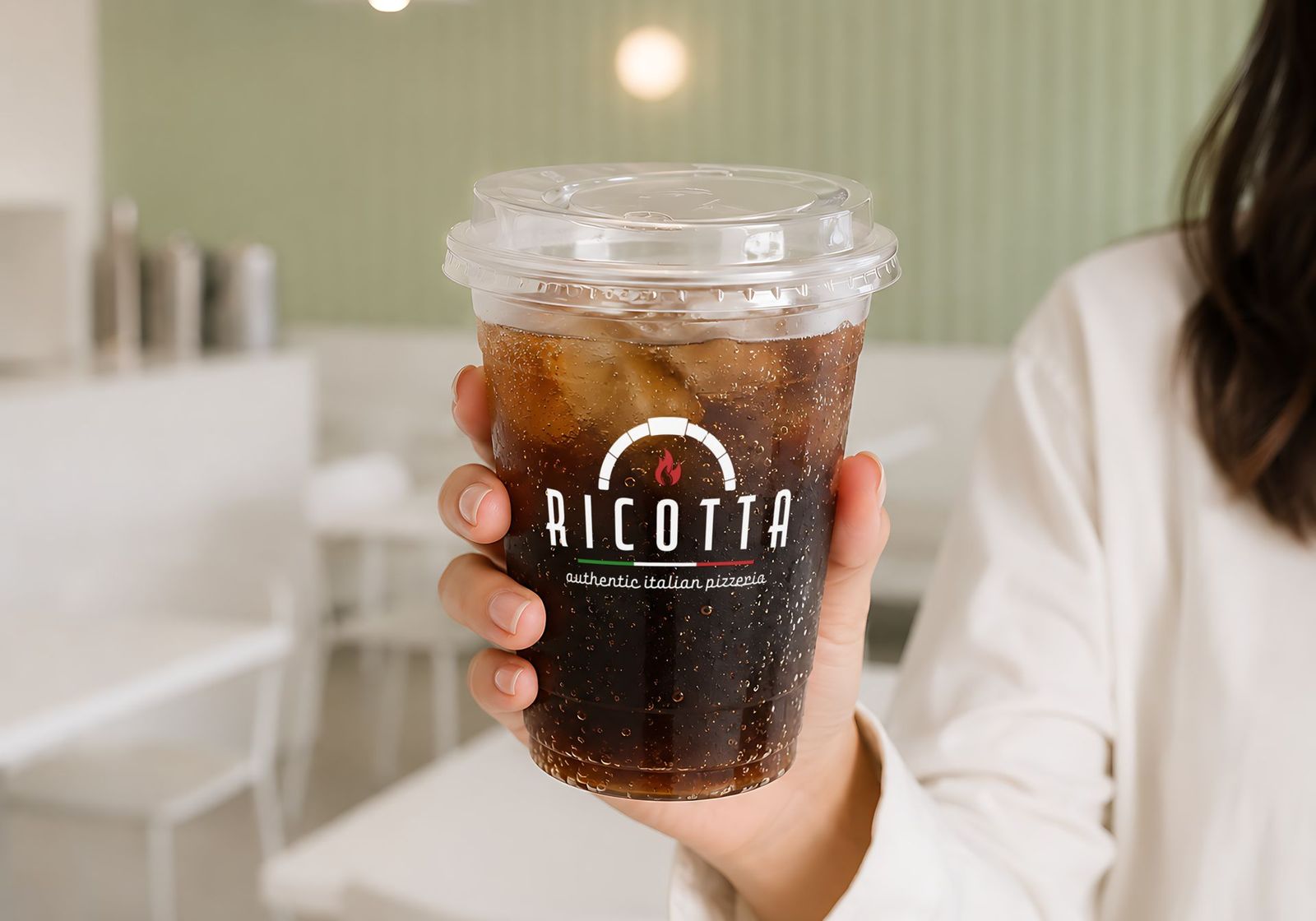 Ricotta logo on a clear iced drink cup